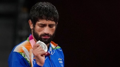 India's Ravi Dahiya holds his silver medal during the medal ceremony of the men's freestyle 57kg wrestling event at Tokyo Olympics (PTI) India's Ravi Dahiya holds his silver medal during the medal ceremony of the men's freestyle 57kg wrestling event at Tokyo Olympics (PTI)