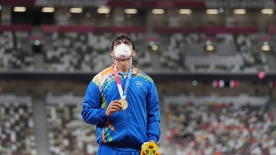 Tokyo: India's Neeraj Chopra holds his gold medal during the medal ceremony, after winning in the final of the men's javelin throw event at the 2020 Summer Olympics, in Tokyo, Saturday, Aug. 7, 2021. Chopra became the first to win Athletics Gold for India ever. (PTI Photo/Gurinder Osan)(PTI08_07_2021_000232B) (PTI) Tokyo: India's Neeraj Chopra holds his gold medal during the medal ceremony, after winning in the final of the men's javelin throw event at the 2020 Summer Olympics, in Tokyo, Saturday, Aug. 7, 2021. Chopra became the first to win Athletics Gold for India ever. (PTI Photo/Gurinder Osan)(PTI08_07_2021_000232B) (PTI)