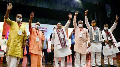 BJP national president JP Nadda, Uttar Pradesh chief minister Yogi Adityanath, and others show victory signs during the Uttar Pradesh block pramukh and district panchayat adhyaksh sammelan, at Indira Gandhi Pratishthan, in Lucknow on Saturday. (ANI Photo) BJP national president JP Nadda, Uttar Pradesh chief minister Yogi Adityanath, and others show victory signs during the Uttar Pradesh block pramukh and district panchayat adhyaksh sammelan, at Indira Gandhi Pratishthan, in Lucknow on Saturday. (ANI Photo)
