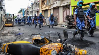 On August 11 last year, a mob gathered in DJ Halli and KG Halli areas of Bengaluru after police sought time to take action over a complaint filed against a Facebook post termed derogatory to Muslims. (AFP) On August 11 last year, a mob gathered in DJ Halli and KG Halli areas of Bengaluru after police sought time to take action over a complaint filed against a Facebook post termed derogatory to Muslims. (AFP)