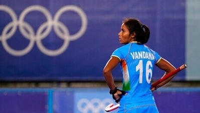 India's Vandana Katariya watches the replay board during a women's field hockey match against Germany at the 2020 Summer Olympics. (AP PHOTO) India's Vandana Katariya watches the replay board during a women's field hockey match against Germany at the 2020 Summer Olympics. (AP PHOTO)