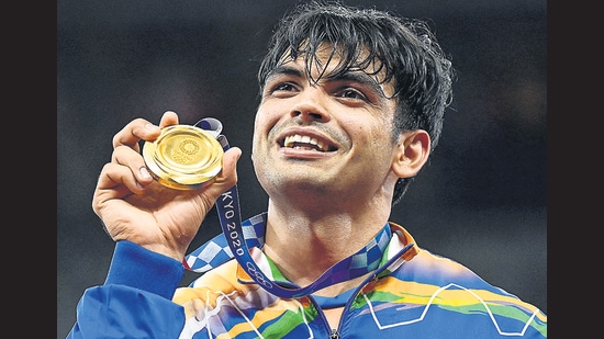 Neeraj Chopra celebrates on the podium during the victory ceremony for the men's javelin throw event during the Tokyo 2020 Olympic Games. (AFP via Getty Images)