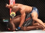 Derrick Lewis (red gloves) fights Ciryl Gane (blue gloves) during UFC 265 at Toyota Center. 