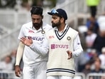 Mohammad Siraj, left, listens to captain Virat Kohli before bowling his next delivery during the fourth day of first test cricket match between England and India, at Trent Bridge in Nottingham.(AP) Mohammad Siraj, left, listens to captain Virat Kohli before bowling his next delivery during the fourth day of first test cricket match between England and India, at Trent Bridge in Nottingham.(AP)