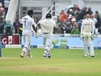 England wicketkeeper Jos Buttler, right, reacts as Indian batsmen KL Rahul, left, and Rishabh Pant walk off the field after rain stopped play during the third day of first test cricket match between England and India.(AP) England wicketkeeper Jos Buttler, right, reacts as Indian batsmen KL Rahul, left, and Rishabh Pant walk off the field after rain stopped play during the third day of first test cricket match between England and India.(AP)