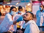 A health worker collects a nasal swab sample to test for Covid-19 during the Kumbh on April 12.(AFP) A health worker collects a nasal swab sample to test for Covid-19 during the Kumbh on April 12.(AFP)