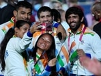 Bajrang Punia clicks a picture with fellow members of the Indian contingent at the Tokyo 2020 Olympics closing ceremony.(AP)