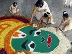 Teacher and students at RBK Global school in Bhayander prepare rangoli for Onam celebrations, in Mumbai.