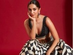 Kiara, opted for a black and white JJ Valaya's lehenga to which she gave a fusion touch by adding a tanned belt.(Instagram/@kiaraaliaadvani)
