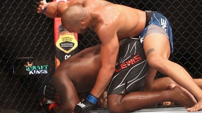 Derrick Lewis (red gloves) fights Ciryl Gane (blue gloves) during UFC 265 at Toyota Center. (USA TODAY Sports)