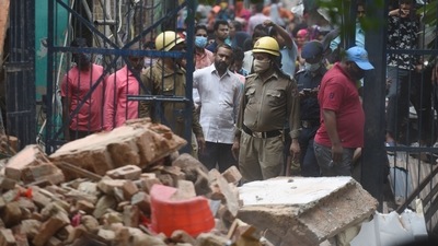 A rescue operation underway by Fire Brigade personnel after a three storey building collapsed amid rain showers in Delhi's Nand Nagri. (Sanchit Khanna/Hindustan Times) A rescue operation underway by Fire Brigade personnel after a three storey building collapsed amid rain showers in Delhi's Nand Nagri. (Sanchit Khanna/Hindustan Times)
