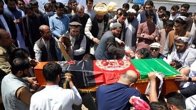 Afghans bury Dawa Khan Menapal, director of Afghanistan’s government information media centre, in Kabul. (AP) Afghans bury Dawa Khan Menapal, director of Afghanistan’s government information media centre, in Kabul. (AP)