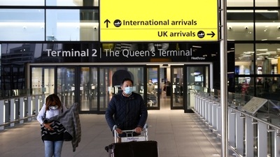 Travellers walk through Terminal 2 at Heathrow Airport, amid the coronavirus disease (Covid-19) outbreak in London, Britain. (File Photo / REUTERS)