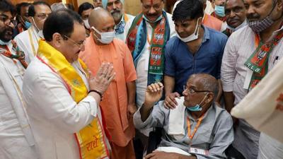 BJP national president JP Nadda meets Dalbir Singh, the party MLA from Barauli (Aligarh) in Uttar Pradesh, on Sunday. Uttar Pradesh chief minister Yogi Adityanath is seen with Nadda. (ANI PHOTO)