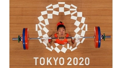 Saikhom Mirabai Chanu competes in the women's 49kg weightlifting competition during the Tokyo 2020 Olympic Games at the Tokyo International Forum on July 24. Chanu lifted the spirits of the entire nation as she ended a 21-year wait for a medal in weightlifting, clinching a silver medal in the 49kg category to open India's account on the very first day of the Tokyo Games. (Chris Graythen / AFP) Saikhom Mirabai Chanu competes in the women's 49kg weightlifting competition during the Tokyo 2020 Olympic Games at the Tokyo International Forum on July 24. Chanu lifted the spirits of the entire nation as she ended a 21-year wait for a medal in weightlifting, clinching a silver medal in the 49kg category to open India's account on the very first day of the Tokyo Games. (Chris Graythen / AFP)