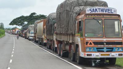 The trucks were held up on Assam’s side of the border with Mizoram by the locals who are angry about killing of 6 Assam policemen in exchange of fire with Mizoram police. (HT Photo)