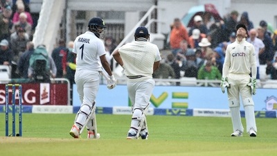 England wicketkeeper Jos Buttler, right, reacts as Indian batsmen KL Rahul, left, and Rishabh Pant walk off the field after rain stopped play during the third day of first test cricket match between England and India. (AP) England wicketkeeper Jos Buttler, right, reacts as Indian batsmen KL Rahul, left, and Rishabh Pant walk off the field after rain stopped play during the third day of first test cricket match between England and India. (AP)