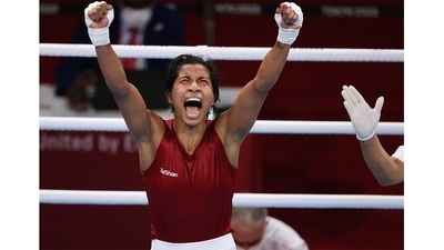 Lovlina Borgohain celebrates after the fight against Chen Nien-Chin of Chinese Taipei during women's Welterweight Boxing Quarterfinal at Kokugikan Arena on July 30. Competing in her maiden Olympics, Borgohain carved a niche for herself in the history of Indian women's boxing by clinching a bronze. With the feat, she became only the third Indian boxer ever, after Vijender Singh and MC Mary Kom, to finish on the podium at the quadrennial showpiece. (Ueslei Marcelino / REUTERS) Lovlina Borgohain celebrates after the fight against Chen Nien-Chin of Chinese Taipei during women's Welterweight Boxing Quarterfinal at Kokugikan Arena on July 30. Competing in her maiden Olympics, Borgohain carved a niche for herself in the history of Indian women's boxing by clinching a bronze. With the feat, she became only the third Indian boxer ever, after Vijender Singh and MC Mary Kom, to finish on the podium at the quadrennial showpiece. (Ueslei Marcelino / REUTERS)