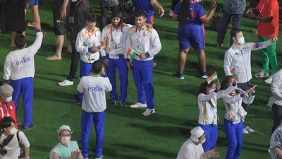 Tokyo: Indian wrestlers Bajrang Punia (C) and Deepak Punia (R) with others at the Olympics Stadium during the closing ceremony of the Summer Olympics 2020, in Tokyo, Sunday, Aug. 8, 2021. (PTI Photo/Gurinder Osan) (PTI08_08_2021_000123A) (PTI)