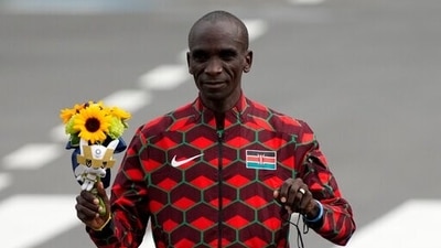 Gold medalist Eliud Kipchoge, of Kenya, poses during the flower ceremony for men's marathon at the 2020 Summer Olympics. (AP) Gold medalist Eliud Kipchoge, of Kenya, poses during the flower ceremony for men's marathon at the 2020 Summer Olympics. (AP)