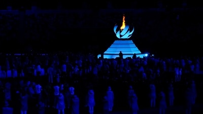 The Olympic flame burns during the closing ceremony in the Olympic Stadium at the 2020 Summer Olympics, Sunday, Aug. 8, 2021, in Tokyo, Japan. (AP Photo/Charlie Riedel) (AP)