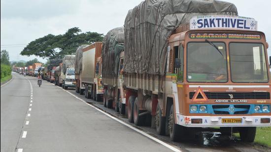 The trucks were held up on Assam’s side of the border with Mizoram by the locals who are angry about killing of 6 Assam policemen in exchange of fire with Mizoram police. (HT Photo)