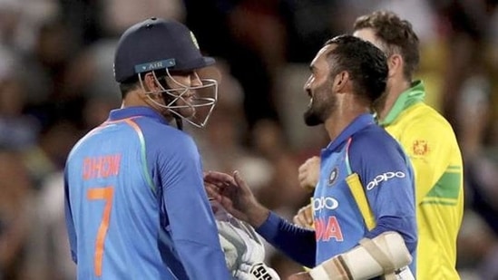 M.S. Dhoni (7) and teammate Dinesh Karthik celebrate their win over Australia during their one day international cricket match in Adelaide.(AP)