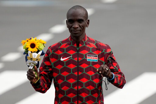 Gold medalist Eliud Kipchoge, of Kenya, poses during the flower ceremony for men's marathon at the 2020 Summer Olympics. (AP) Gold medalist Eliud Kipchoge, of Kenya, poses during the flower ceremony for men's marathon at the 2020 Summer Olympics. (AP)