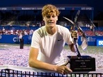 Jannik Sinner of Italy holds the championship trophy after his singles finals match against Mackenzie McDonald of the United States (not pictured) at Citi Open.