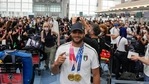 Tokyo: Lamont Marcell Jacobs of Italy shows the gold medals he won in the men's 100mt and 4x100 relay as he checks in at the Tokyo Haneda airport on his way back to Italy at the end of 2020 Summer Olympics, Monday, Aug. 2, 2021, in Tokyo, Japan. AP/PTI Photo(AP08_09_2021_000016B)(AP) Tokyo: Lamont Marcell Jacobs of Italy shows the gold medals he won in the men's 100mt and 4x100 relay as he checks in at the Tokyo Haneda airport on his way back to Italy at the end of 2020 Summer Olympics, Monday, Aug. 2, 2021, in Tokyo, Japan. AP/PTI Photo(AP08_09_2021_000016B)(AP)
