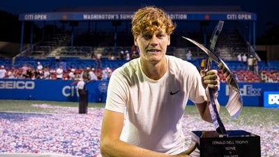 Jannik Sinner of Italy holds the championship trophy after his singles finals match against Mackenzie McDonald of the United States (not pictured) at Citi Open. (USA TODAY Sports)