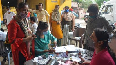 Residents attending a medical camp at Ekta Vihar in Zirakpur’s Baltana area on Monday. Around 60 have been admitted to the civil hospital in Panchkula. (Sant Arora/HT) Residents attending a medical camp at Ekta Vihar in Zirakpur’s Baltana area on Monday. Around 60 have been admitted to the civil hospital in Panchkula. (Sant Arora/HT)