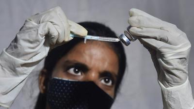 A medic prepares a dose of Covid vaccine in Kolkata on August 7. (PTI)