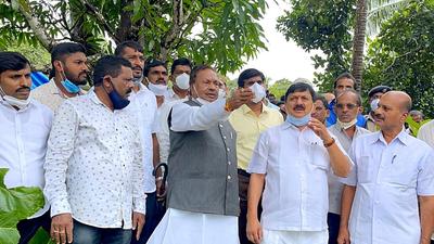 Karnataka, August 06 (ANI): Karnataka Minister K. S. Eshwarappa with others inspects the flood-affected areas of Kodagu Majare, in Bekshe Kenjagudde Mandagadde on Friday. (ANI Photo) (ANI) Karnataka, August 06 (ANI): Karnataka Minister K. S. Eshwarappa with others inspects the flood-affected areas of Kodagu Majare, in Bekshe Kenjagudde Mandagadde on Friday. (ANI Photo) (ANI)