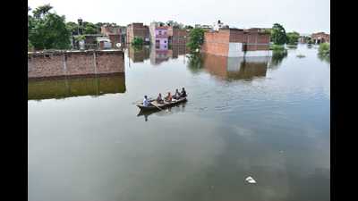 A view of houses submerged with risen water level of river Ganga following monsoon rain in Prayagraj on Monday. (HT Photo) A view of houses submerged with risen water level of river Ganga following monsoon rain in Prayagraj on Monday. (HT Photo)