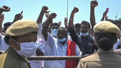 Police stand guard as the members of the fishermen community and activists shout slogans during a protest against the Indian Marine Fisheries Bill in Chennai on August 9. (AFP) Police stand guard as the members of the fishermen community and activists shout slogans during a protest against the Indian Marine Fisheries Bill in Chennai on August 9. (AFP)