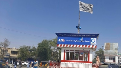 A Taliban flag flies in the main square of Kunduz city after fighting between Taliban and Afghan security forces, on Sunday. (AP Photo)