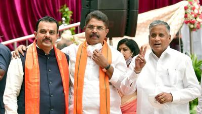 Bengaluru: Newly inducted Karnataka Ministers R Ashoka (C),V Sunil Kumar and V Somanna (R) during swearing-in ceremony at Raj Bhavan in Bengaluru, Wednesday, Aug. 4, 2021. (PTI Photo/Shailendra Bhojak)(PTI08_04_2021_000309B) (PTI)