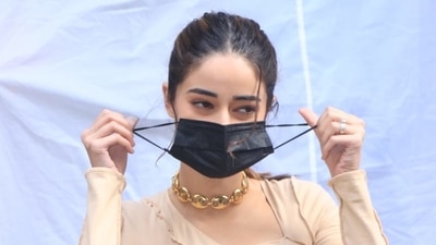 Ananya Pandey pulling off her mask for pictures. Ananya Pandey pulling off her mask for pictures.
