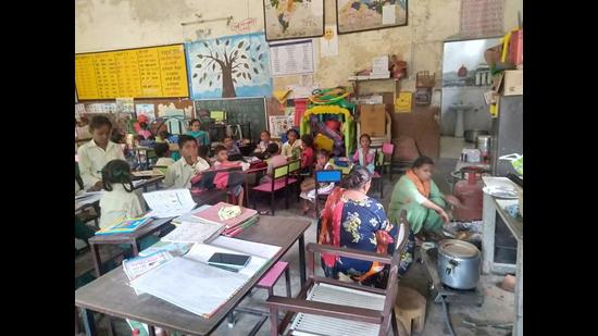 Students attending their class in a community hall in Moga.