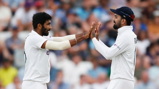 India's Jasprit Bumrah celebrates taking the wicket of England's Jos Buttler with KL Rahul.(Action Images via Reuters)