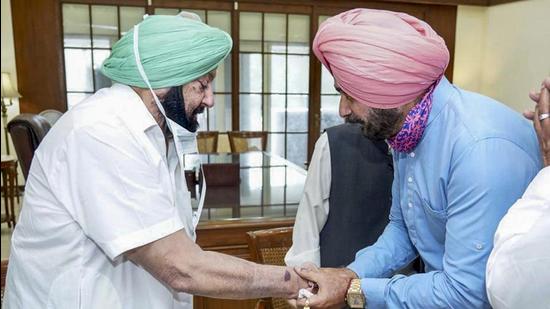 Punjab Congress Committee president Navjot Singh Sidhu meeting with Punjab chief minister Capt. Amarinder Singh. (PTI File)