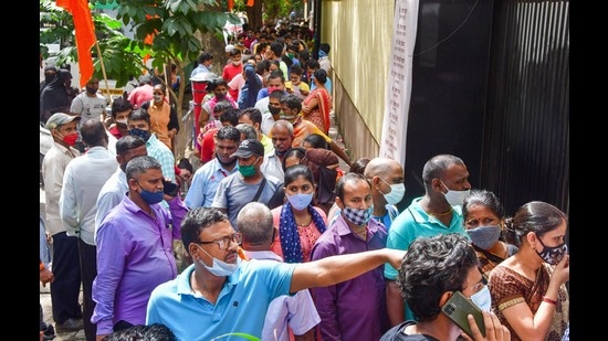 Beneficiaries wait to receive a dose of COVID-19 vaccine during mass vaccination drive organised by Shiv Sena in association with Reliance hospital, in Mumbai, Monday (PTI)