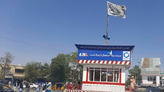 A Taliban flag flies in the main square of Kunduz city after fighting between Taliban and Afghan security forces, on Sunday.(AP Photo)