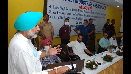 Punjab health and labour minister Balbir Singh Sidhu speaking at the handover ceremony of Phases 8A and 8B of the Industrial Area in Mohali on Monday. (Keshav SIngh/HT)