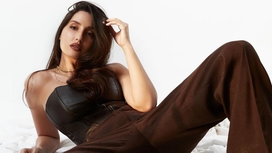 Nora Fatehi glams up vintage pantsuit and corset with ₹57k pumps