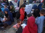 Internally displaced Afghans who fled their home in north provinces due to fighting between the Taliban and Afghan security personnel, are seen at a public park in Kabul, on Monday.