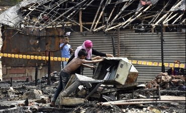 The government said that illegal Rohingya migrants are indulging in illegal activities. Rohingya refugees inspecting an area after a fire broke out at a Rohingya camp near Kalindi Kunj on June 13. ( Sunil Ghosh / Hindustan Times)