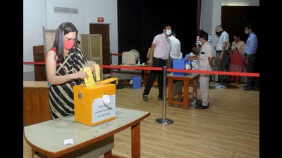 Polling underway at the law auditorium in Panjab University, Chandigarh, on Tuesday. (Ravi Kumar/HT)
