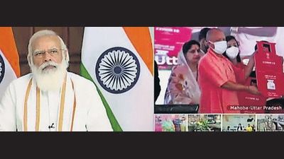 Prime Minister Narendra Modi launches Pradhan Mantri Ujjwala Yojana 2.0 at Mahoba (Uttar Pradesh), via video conference in New Delhi on Tuesday. (PTI Photo) Prime Minister Narendra Modi launches Pradhan Mantri Ujjwala Yojana 2.0 at Mahoba (Uttar Pradesh), via video conference in New Delhi on Tuesday. (PTI Photo)